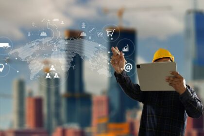 Construction engineer in a hard hat using a tablet with digital overlay icons.