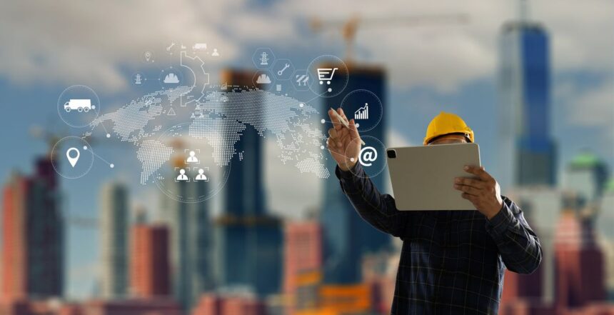 Construction engineer in a hard hat using a tablet with digital overlay icons.