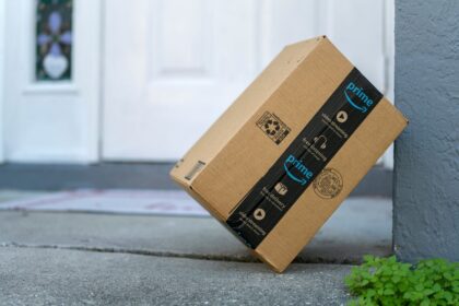 An Amazon Prime package sitting on a front porch step.