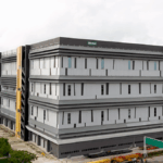 Aerial view of the modern, multi-story Bio-Rad industrial facility.