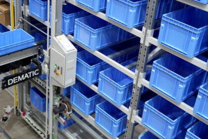 Dematic Multishuttle FD system handling blue storage totes in an automated warehouse shelving system.