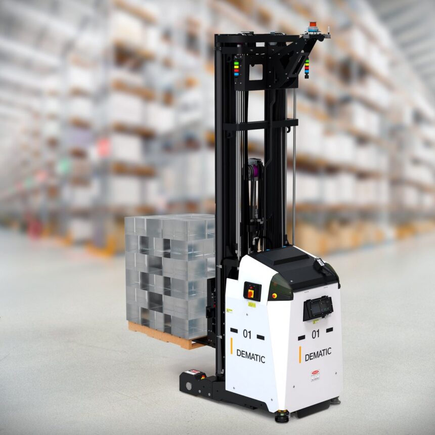 An automated Dematic forklift carrying a stack of crates in a warehouse.