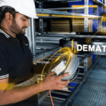 Worker in a hard hat inspects warehouse technology with digital data overlays.