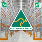 Australian Made logo superimposed over a warehouse aisle with empty industrial pallet racking.