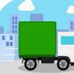 A white delivery truck with a green cargo container driving through a city.