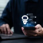 Person using a smartphone with a floating AI chatbot interface and messaging icons.