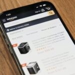 A smartphone displaying the Amazon website's best-selling ice makers list.