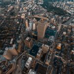 Aerial view of skyscrapers and dense city streets in Boston at twilight.