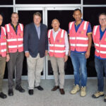 GPC and Manhattan Associates team members standing together at a Brisbane warehouse facility, marking the launch of a next-generation warehouse system.