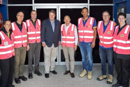 GPC and Manhattan Associates team members standing together at a Brisbane warehouse facility, marking the launch of a next-generation warehouse system.
