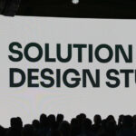 Manhattan Associates presentation introducing Solution Design Studio, an AI-powered supply chain configuration workspace, at a conference event.