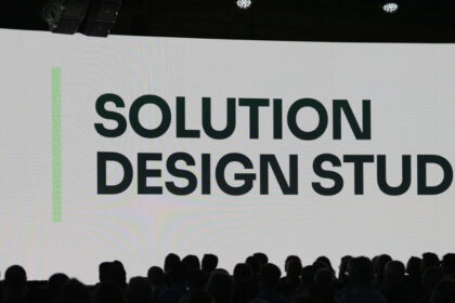 Manhattan Associates presentation introducing Solution Design Studio, an AI-powered supply chain configuration workspace, at a conference event.