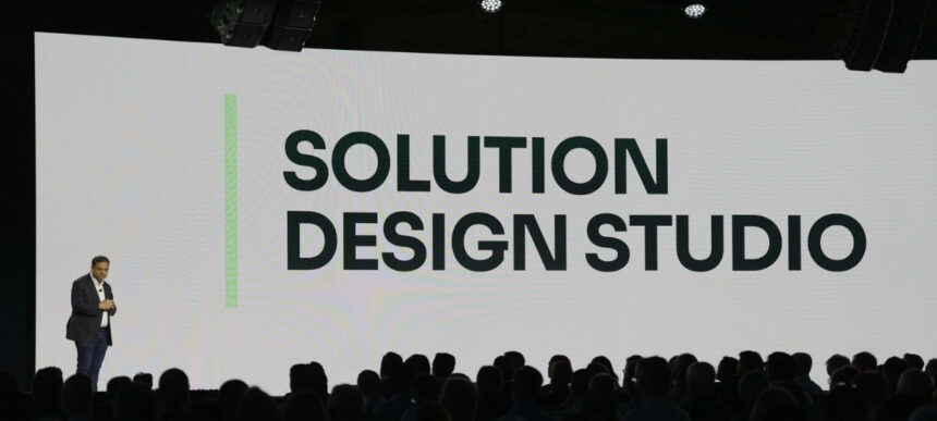 Manhattan Associates presentation introducing Solution Design Studio, an AI-powered supply chain configuration workspace, at a conference event.