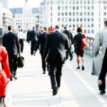Alt text: Business professionals walking through a city centre, representing small business growth and AI adoption across Australia.