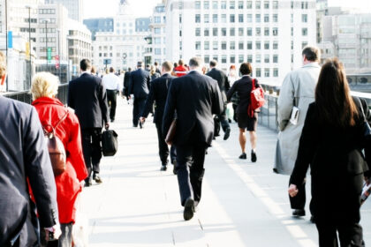 Alt text: Business professionals walking through a city centre, representing small business growth and AI adoption across Australia.