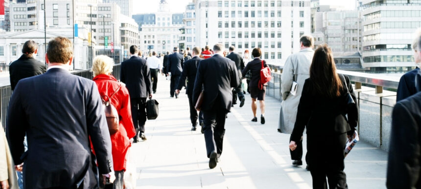 Alt text: Business professionals walking through a city centre, representing small business growth and AI adoption across Australia.