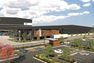 Artist render of Asahi Beverages’ proposed major distribution facility in Queensland, showing a large warehouse, truck loading areas and car parking.
