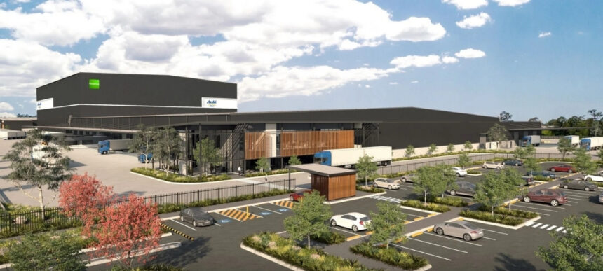 Artist render of Asahi Beverages’ proposed major distribution facility in Queensland, showing a large warehouse, truck loading areas and car parking.