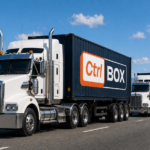 A convoy of semi-trailer trucks carrying shipping containers branded with the CtrlBOX logo travels along a coastal highway under a blue sky, illustrating large-scale freight transport and logistics operations.