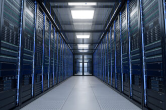 Modern data centre with rows of server racks in a climate-controlled server room.