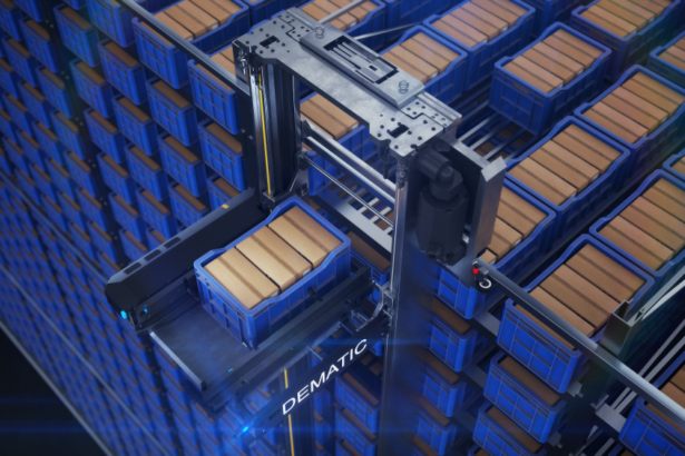 An automated shuttle system retrieves a blue storage tote from a high-density warehouse storage grid filled with stacked containers, illustrating automated goods-to-person fulfilment technology.