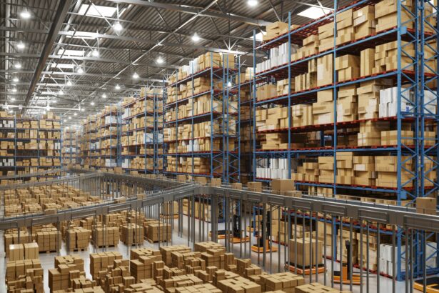Large modern warehouse with rows of high storage racks filled with boxes and automated material handling systems below.