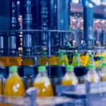 Bottled drinks on a manufacturing conveyor.
